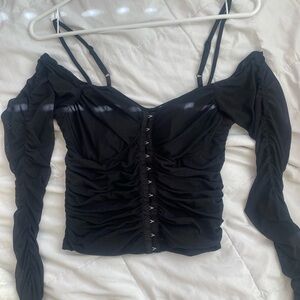size small.Corset like top.With this straps and off the shoulder sleeves